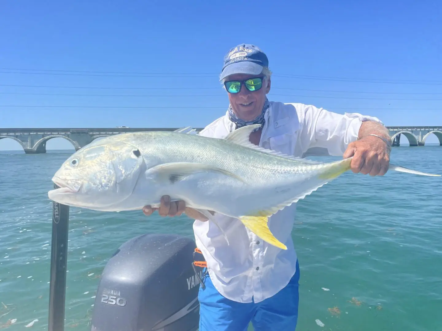 A person holding a big fish