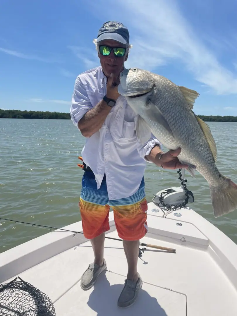 A man holding a large fish