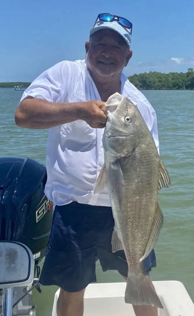 A man holding a big fish