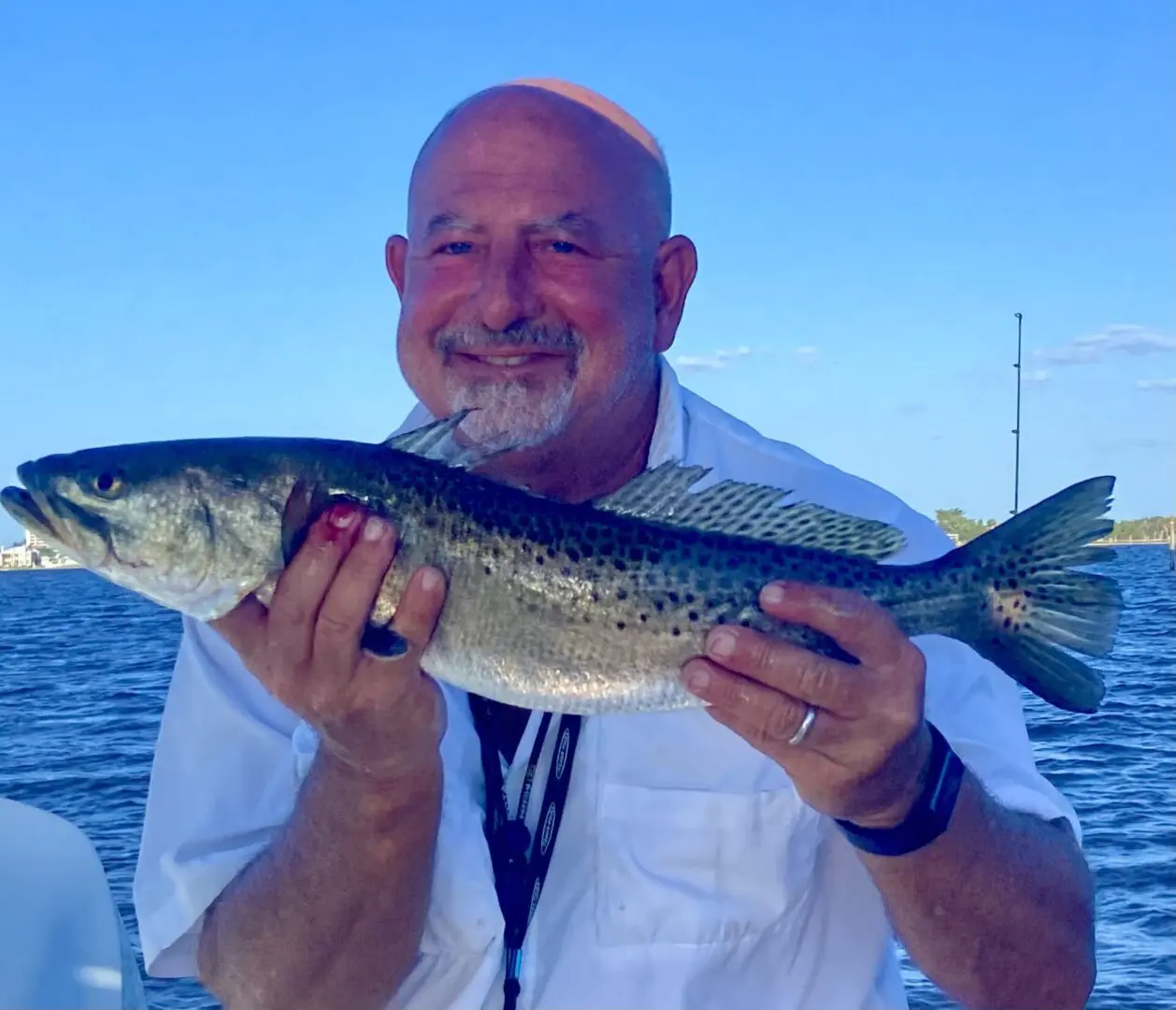 A man holding a medium-sized fish